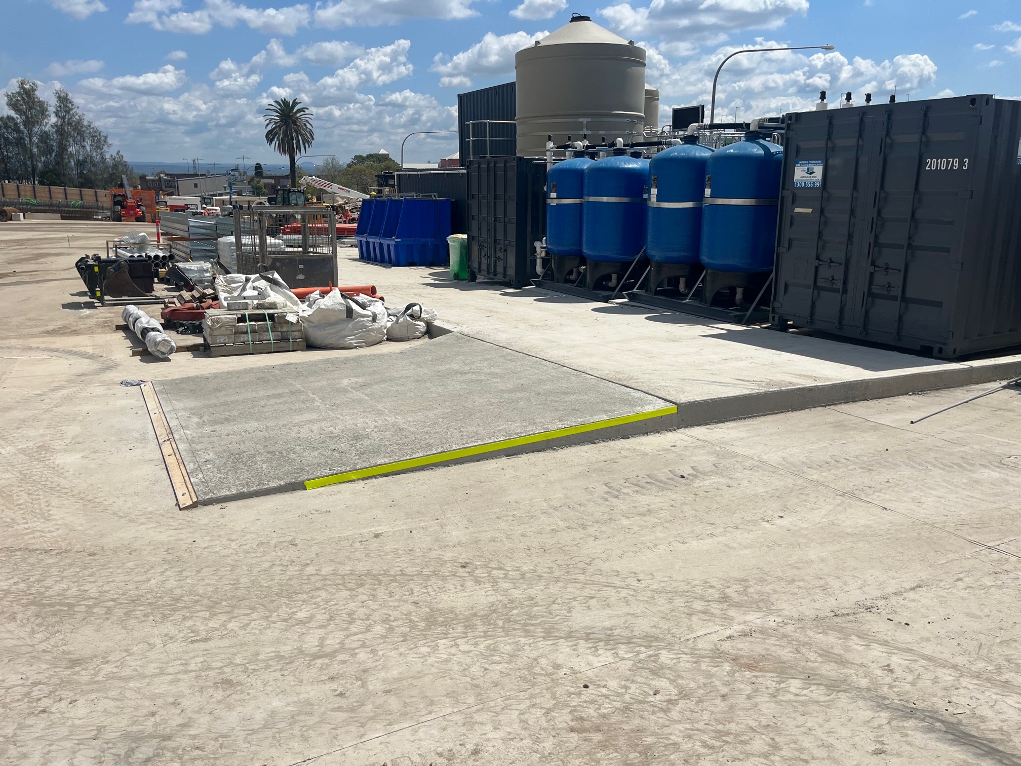 Blue media filter vessels and containerised treatment plant on the concrete pad at the St Marys site (photo courtesy of Aquatic Engineering)